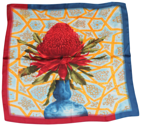 A thin scarf with a large red flower